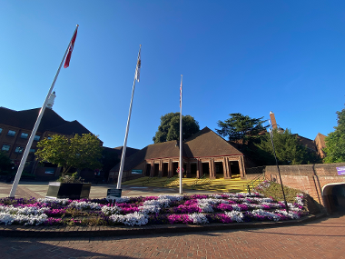 External view of the Civic Centre with blue skies and Platinum Jubilee flower bed