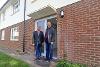 Cllr Jonathan Bianco and Cllr Eddie Lavery outside the newly-renovated property