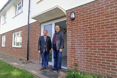 Cllr Jonathan Bianco and Cllr Eddie Lavery outside the newly-renovated property
