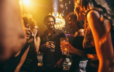 A group of young people celebrate on a night out