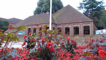 Picture of front of Civic Centre with red flowers in foreground