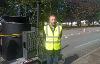Cllr Jonathan Bianco next to a RoadMender machine like the one the council will use