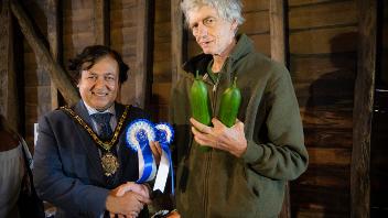 The Mayor of Hillingdon with prize-winner Peter Bird and his cucumbers