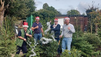Staff from the Rural Activities Garden Centre with their home-grown Christmas trees