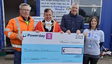 Cllr Eddie Lavery and the Mayor of Hillingdon holding a giant cheque for £50,000 standing alongside representatives from Powerday - who run the council's waste facility in West Drayton - and Hillingdon Hospice.