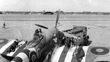 Photo of men working on a Spitfire 