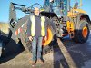 Cllr Eddie Lavery stands in front of a new Develon shove at the Harefield Civic Amenity Site.