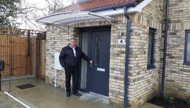 Cllr Steve Tuckwell outside one of the new council homes in Harefield