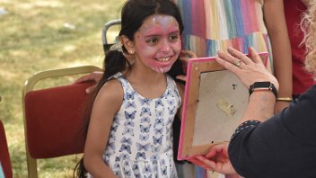 A girl has just had her face painted at Picnic in the Park