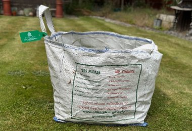 Garden waste bag with tag