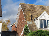 Photo of the house of Ms Naylor and her chimney which she was told could fall down