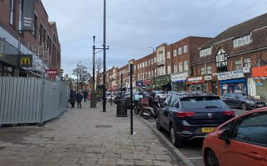 GV of Ruislip High Street showing motorbikes in pay and display bays