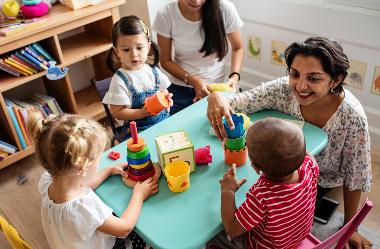 Nursery children playing in classroom