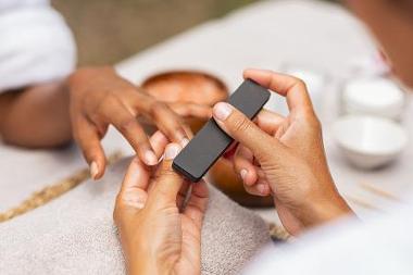 Woman receiving a manicure