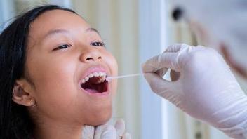Woman getting a COVID swab