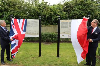 HE Professor Arkady Rzegocki,  Ambassador of the Republic of Poland to the Court of St James’s and Cllr Puddifoot MBE, Hillingdon Council’s Armed Forces Champion unveil the new Polish Army boards in the Polish Forces Remembrance Garden in the 