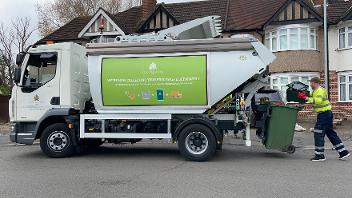 Food waste truck on road