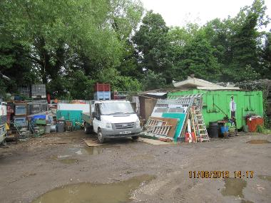 Vehicles, parts and container units stored on Green Belt land at Brookside in Harmondsworth