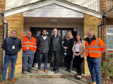 Cllr Mills, officers and Openreach staff at site of first building connected to full fibre under council's new partnership with Openreach.