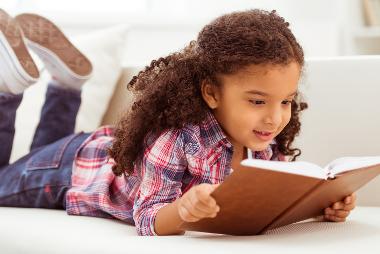 Young girl reading a book